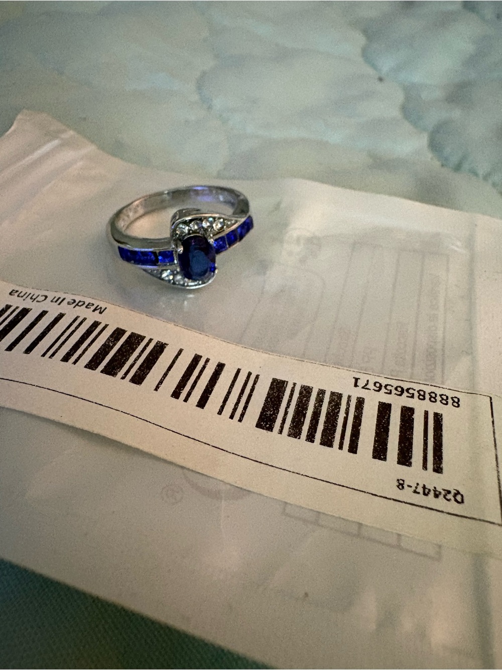 Silver plated Ring with Oval Blue sapphire Gem and Blue Accent Stones
Sz 7